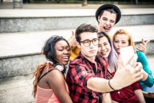 teenagers taking selfies